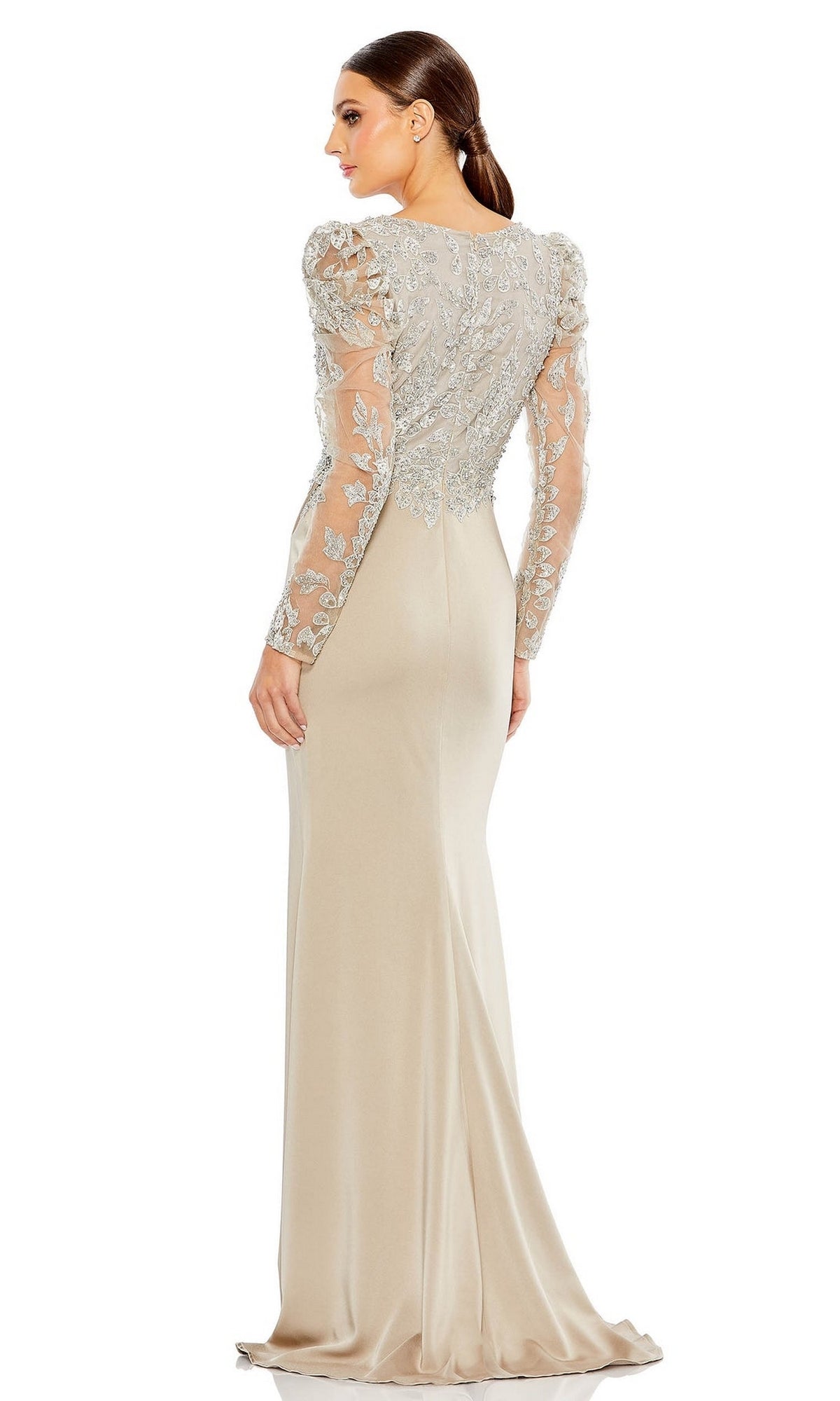 Woman wearing the Long Formal Dress 20346 by Mac Duggal, featuring a fitted taupe silhouette with sheer embroidered long sleeves and intricate floral embroidery on the bodice, standing with her back to the camera.